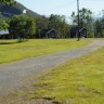 Sandnes Fjord Camping - Sanitary building to the left, and 3 of 10 cottages at the site.