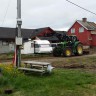 Olderfjord Hotell Russenes Camping - This tractor arrived just before 8 pm. and started working with the ground outside our tent.... The closes grocery shop is 55 kilometer away after 6 pm.  Dinner 200 nok.  Staff do not speak norwegian.. Not much facilities or help..  Lot of people though.