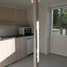 Velfjord Camping & Hytter - Kitchen + place to sit